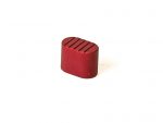 Red metal oval-shaped component with ridges on top isolated on white background.