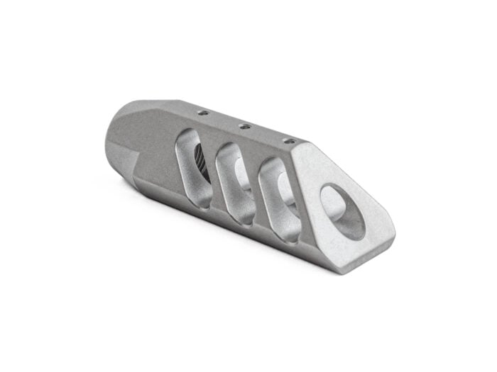 Bead blasted metal muzzle brake with angled ports on a white background.