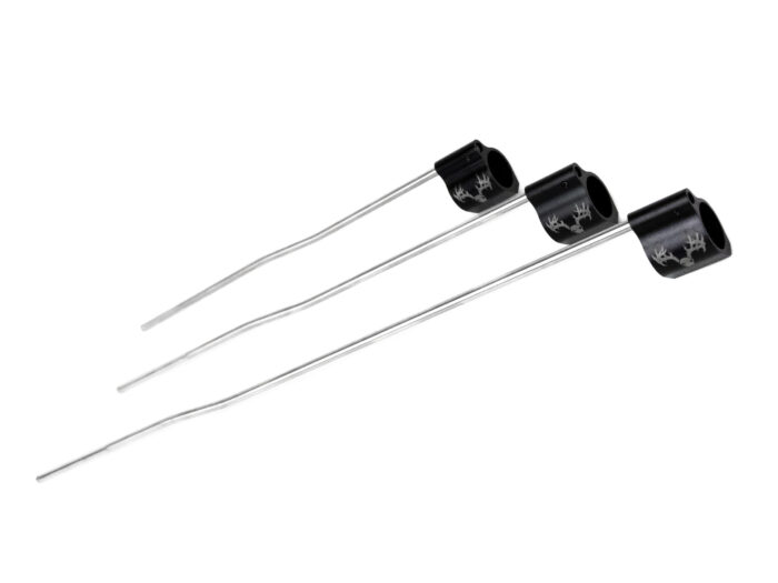 Three metal gas blocks with tubes aligned diagonally on a white background
