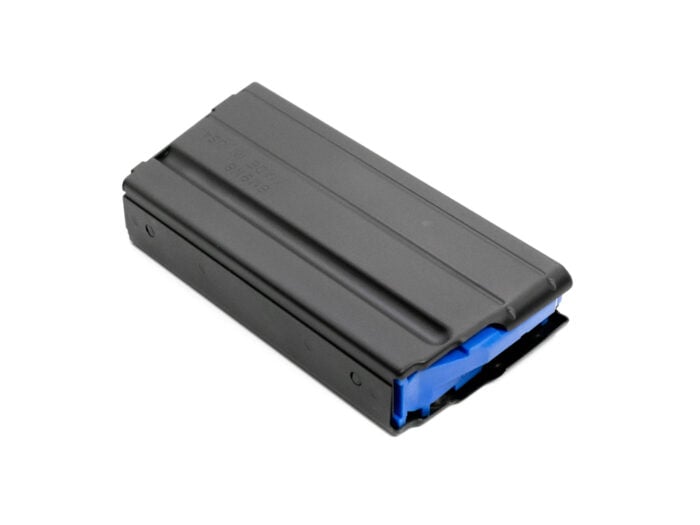 Black metal rifle magazine with blue follower on a white background.