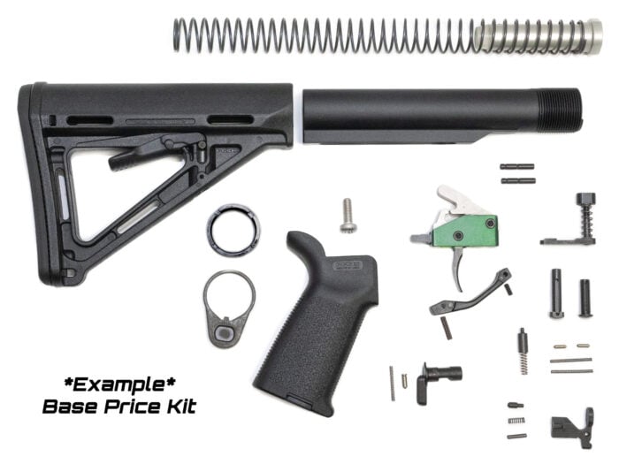 Disassembled AR-15 lower parts kit with stock grip buffer tube trigger and springs laid out.