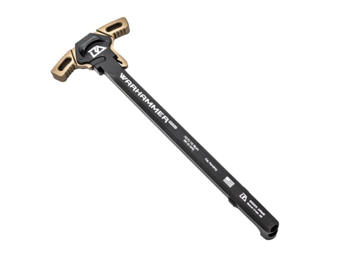 Warhammer AR-15 charging handle by Breek Arms with tan and black finish on a white background.
