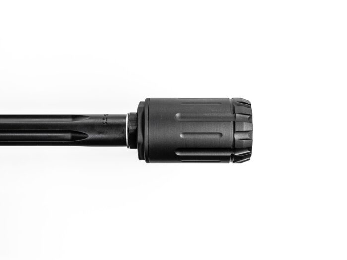 Close-up of a firearm barrel with a black suppressor on a white background.