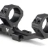 Black 30mm cantilever scope mount with torque specifications engraved on the rings.