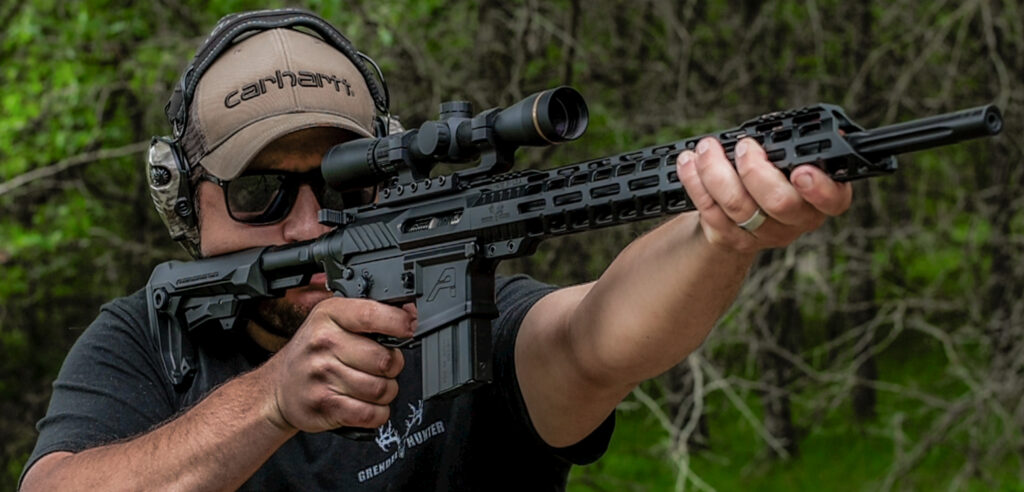 AR-15 handguard on a rifle being fired by a man