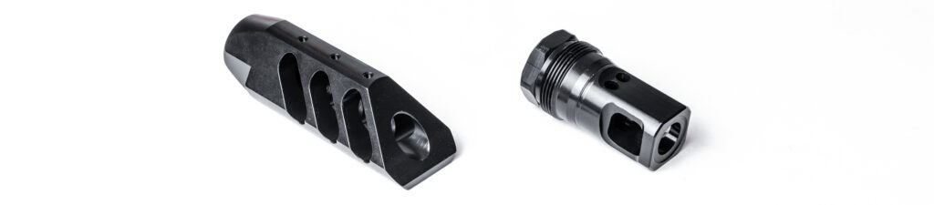 Product photograph featuring two different styles of black recoil-reduction muzzle uppers side-by-side on a white surface. On the left is a large, aggressively angled triple-port muzzle brake with top-venting gas ports, and on the right is a compact, dual-port brake displaying integrated external threading for a quick-detach suppressor or blast shield mechanism.