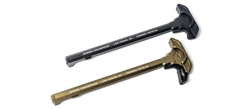 Product photograph showing two Strike Industries AR charging handles angled on a crisp white surface. The top charging handle is a clean matte black finish, and the bottom unit features a metallic flat dark earth (FDE) anodized finish with black textured latch segments. Both handles show white laser-etched markings specifying their 7075-T6 aluminum forging.