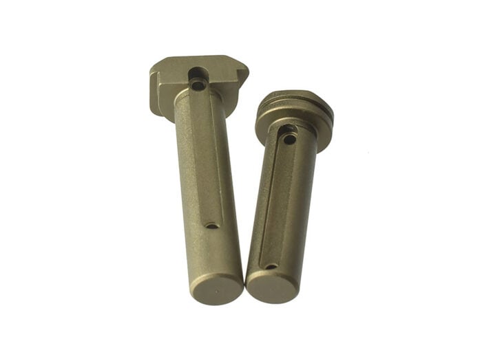 Strike Industries AR-15 extended takedown pins in Flat Dark Earth showing the underside and pin channels